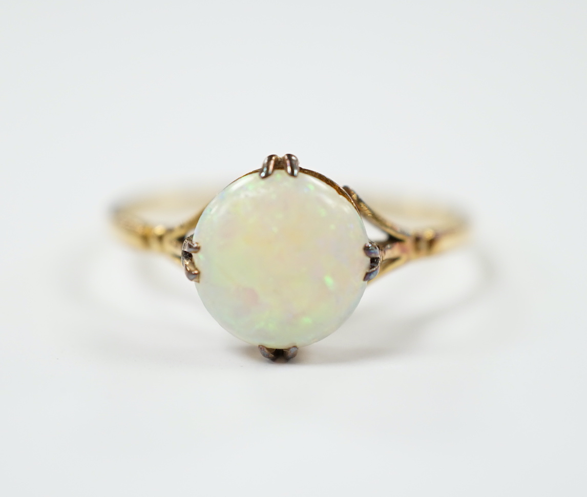 An 18ct and single stone white opal set ring, size S, gross weight 2.5 grams.